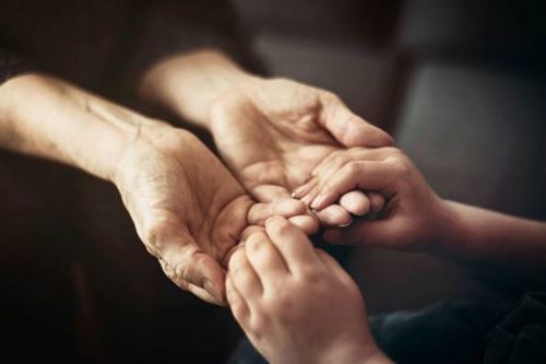 adult-and-child-praying-hands.jpg